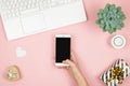 Womens home workspace. Girl Blogger works with phone and laptop. Freelance concept. Teleworker texting using laptop and Royalty Free Stock Photo