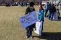 Womens March - protesters at Capitol on cold day - sign Hey Genius Your Karma just ran over your