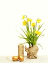 Spring yellow narcissus, golden easter egg and thread or rope Royalty Free Stock Photo