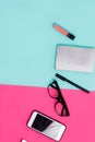 Womens office materials on pink and blue background. Flat lay, Top view