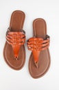 Womens pair of brown leather flat sandals isolated Royalty Free Stock Photo