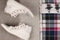 Womens sneakers and plaid shirt with lace insertion. Trendy lac