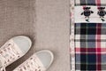 Womens sneakers and plaid shirt with lace insertion. Trendy lace