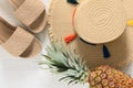 Womens summer accessories straw hat, flip flops, pineapple on