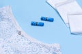 Womens white panties tampons, pads on a blue background