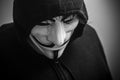 Womman wearing Vendetta mask. This mask is a well-known symbol for the online hacktivist group Anonymous