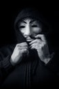 Womman wearing Vendetta mask. This mask is a well-known symbol for the online hacktivist group Anonymous Royalty Free Stock Photo