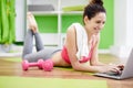 Womn Using Laptop for Workout Royalty Free Stock Photo