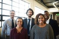 We won our smiles through success. Portrait of a diverse team of happy businesspeople posing together in their office. Royalty Free Stock Photo