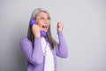 They won. Photo portrait of elder cheerful surprised woman screaming happily on old retro telephone with wire isolated Royalty Free Stock Photo