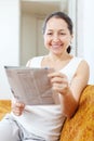 Wonder mature woman with newspaper Royalty Free Stock Photo