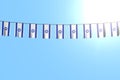 Cute many Israel flags or banners hanging on rope on blue sky background - any celebration flag 3d illustration