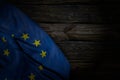 wonderful any holiday flag 3d illustration - dark image of European Union flag with big folds on old wood with empty space for