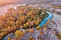 Drone view Autumn forest near the river in the meadow, cool frosty dawn. Royalty Free Stock Photo