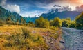 Wonderful autumn view of Caucasus mountains with blue water river. Great sunrise in Upper Svaneti. Royalty Free Stock Photo