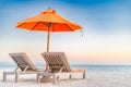 Summer beach background. Vacation and holiday concept, lounge chairs near the sea, luxury scenery Royalty Free Stock Photo