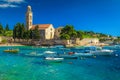 Harbor and waterfront promenade near medieval church, Hvar, Dalmatia, Croatia