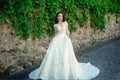 Wonderful bridal gown. Beautiful wedding dresses in boutique. Elegant wedding salon is waiting for bride. woman is