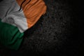 wonderful celebration flag 3d illustration - dark image of Ireland flag with large folds on dark asphalt with empty place for