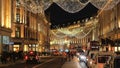 Wonderful Christmas street decoration in London flying angels made of light - LONDON, ENGLAND - DECEMBER 15, 2018