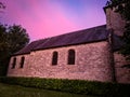 Wonderful church under a rose sunset sunrise landscape
