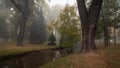 wonderful clean autumn city park with trees along a narrow stream and a light morning fog in the background Royalty Free Stock Photo