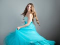 wonderful dancing princess in a lush blue dress, a young beautiful blonde Royalty Free Stock Photo