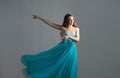 wonderful dancing princess in a lush blue dress, a young beautiful blonde Royalty Free Stock Photo