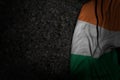 wonderful holiday flag 3d illustration - dark picture of Ireland flag with big folds on dark asphalt with free place for content