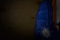 wonderful dark image of Marshall Islands flag with big folds on dark wood with free space for your text - any feast flag 3d