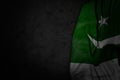 nice any occasion flag 3d illustration - dark picture of Pakistan flag with big folds on black stone with free place for your