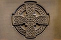 Wonderful embossed Celtic stone cross, full of details and textures in its elaborate carvings.