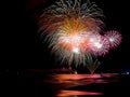 Wonderful fireworks lighting ocean`s water