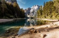 Wonderful foggy morning at Braies lake in Dolomites alps. Amazing nature landscape. lake and Seekofel mount on