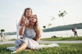 A wonderful girl child makes bubbles with her mom in the park. Royalty Free Stock Photo