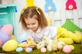 Wonderful girl with yellow ducklings on green Royalty Free Stock Photo