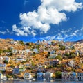 Wonderful Greece. Island Symi. Dollhouses cloud bright day