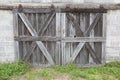 Old Weathered Gray Wood Barn Doors with Rusty Hardware Royalty Free Stock Photo