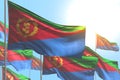 Wonderful many Eritrea flags are waving on blue sky background - any holiday flag 3d illustration