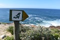 Wonderful landscape with a guidepost with a seal at the hiking trail at Robberg Nature Reserve in Plettenberg Bay, South Africa Royalty Free Stock Photo