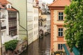 Wonderful landscape of Prague. The flowing river surrounded by colourful buildings.