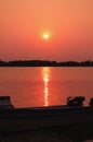 Wonderful landscape of a silhouette of a boat on a amazing sunset