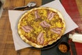 A wonderful medium thin crust pizza with bacon, various meats,