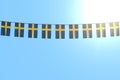 Wonderful memorial day flag 3d illustration - many Sweden flags or banners hanging on rope on blue sky background