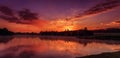 Wonderful misty morning. majestic red sunrise over the foggy lake