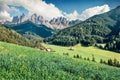 Wonderful morning view of St. Magdalena village. Stunning summer scene of Funes Valley Villnob with Odle Group mountains on Royalty Free Stock Photo