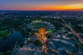 Wonderful Munich sunset from a high view with a festival at the popular Olympic Park and the stadium at a glowing orange Royalty Free Stock Photo