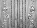 Wonderful old italian door carved on wood with golden dragons.