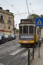 Wonderful Old Yellow Tram With A Photographer Taking Pictures Of The Monuments On Their Step Circulating Down The Streets In