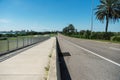 Wonderful panorama of blue sky, empty road and palm trees, Tampa Bay Bridge Royalty Free Stock Photo